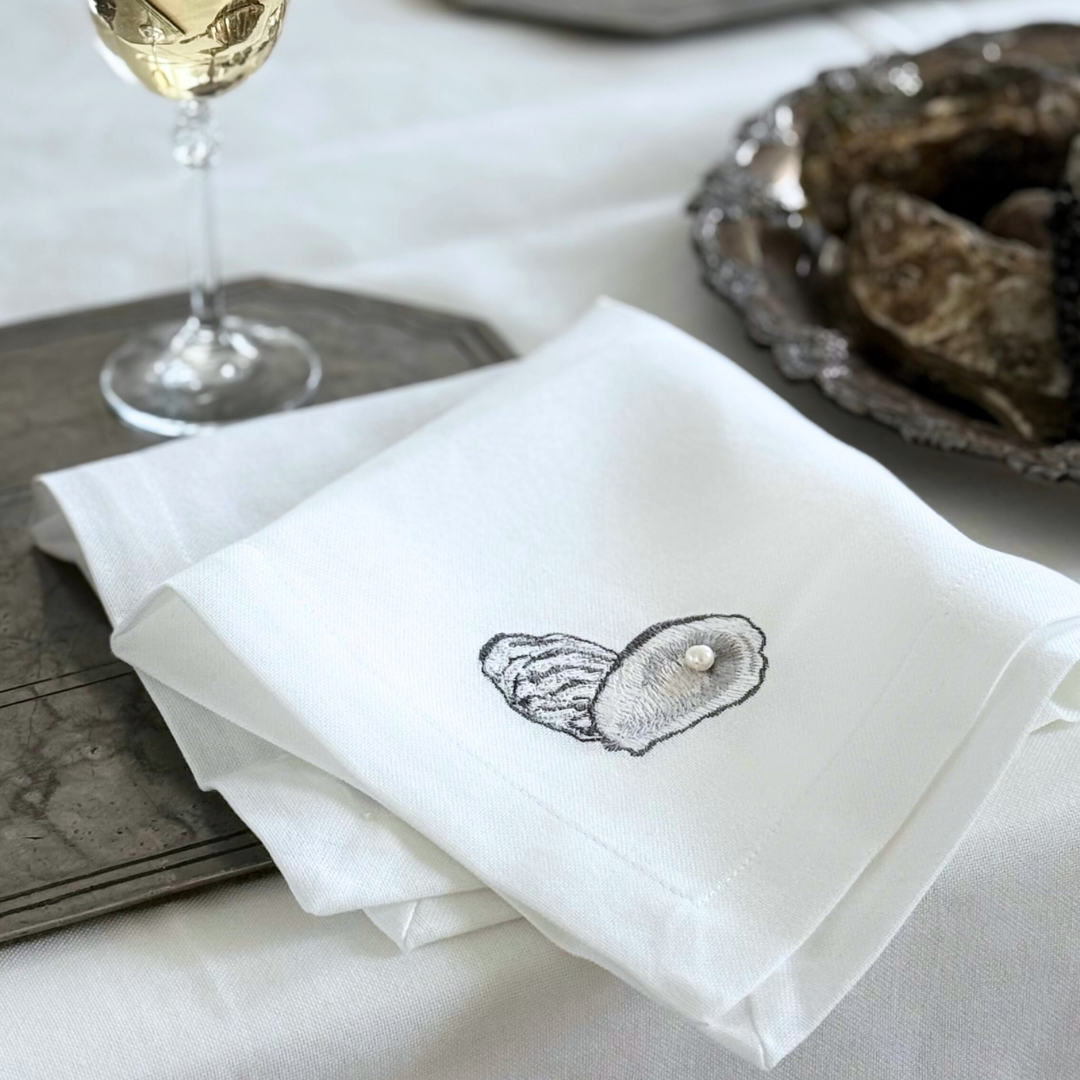 Serviet med østers og perle